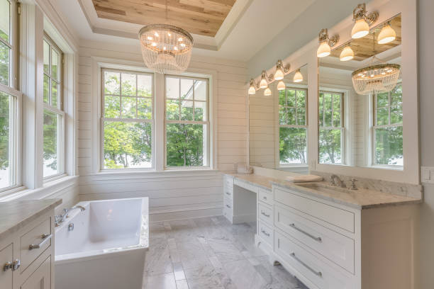 Free standing bathtub and white shiplap walls